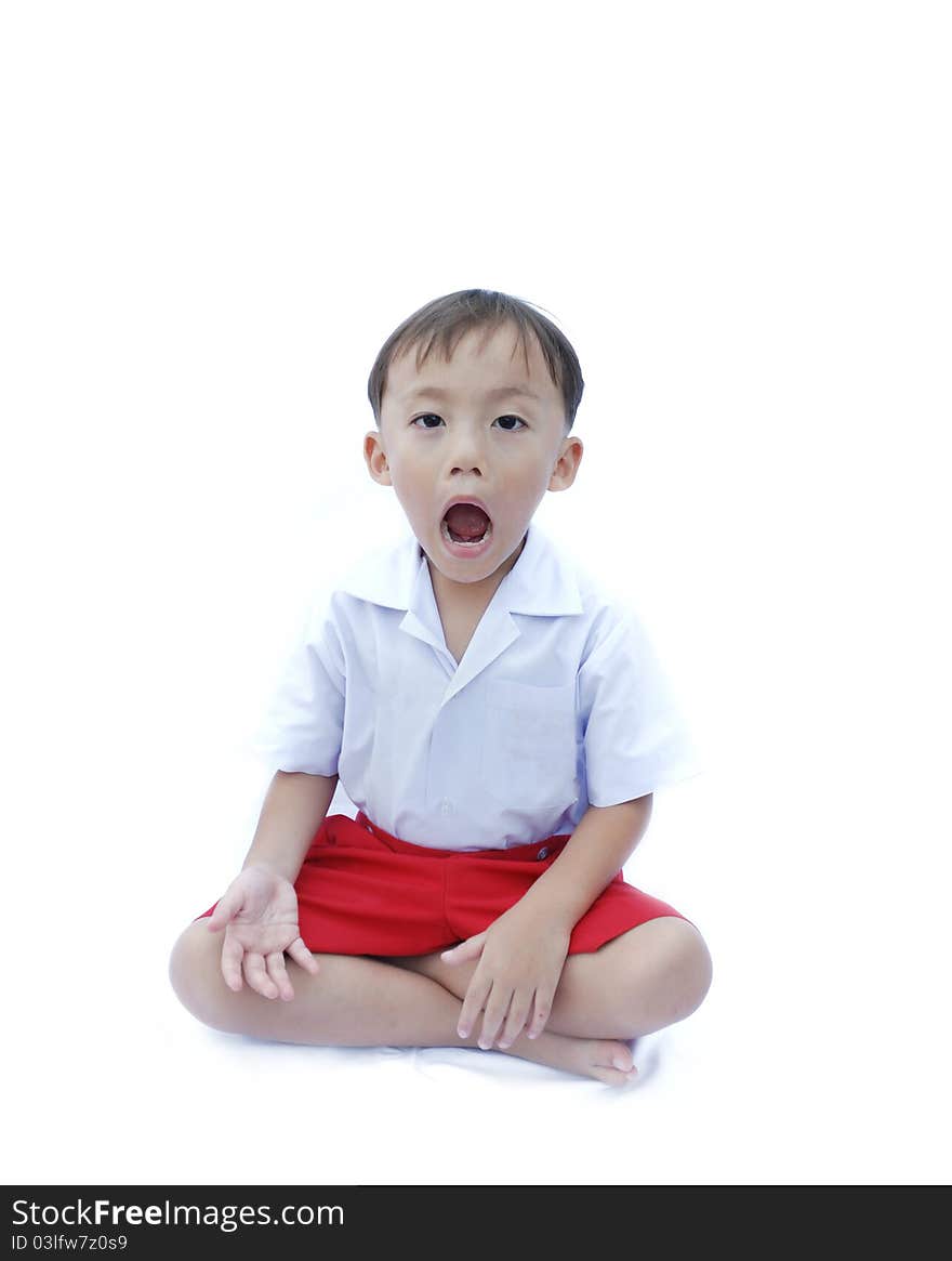 Cute young asian boy in uniform isolated on white background