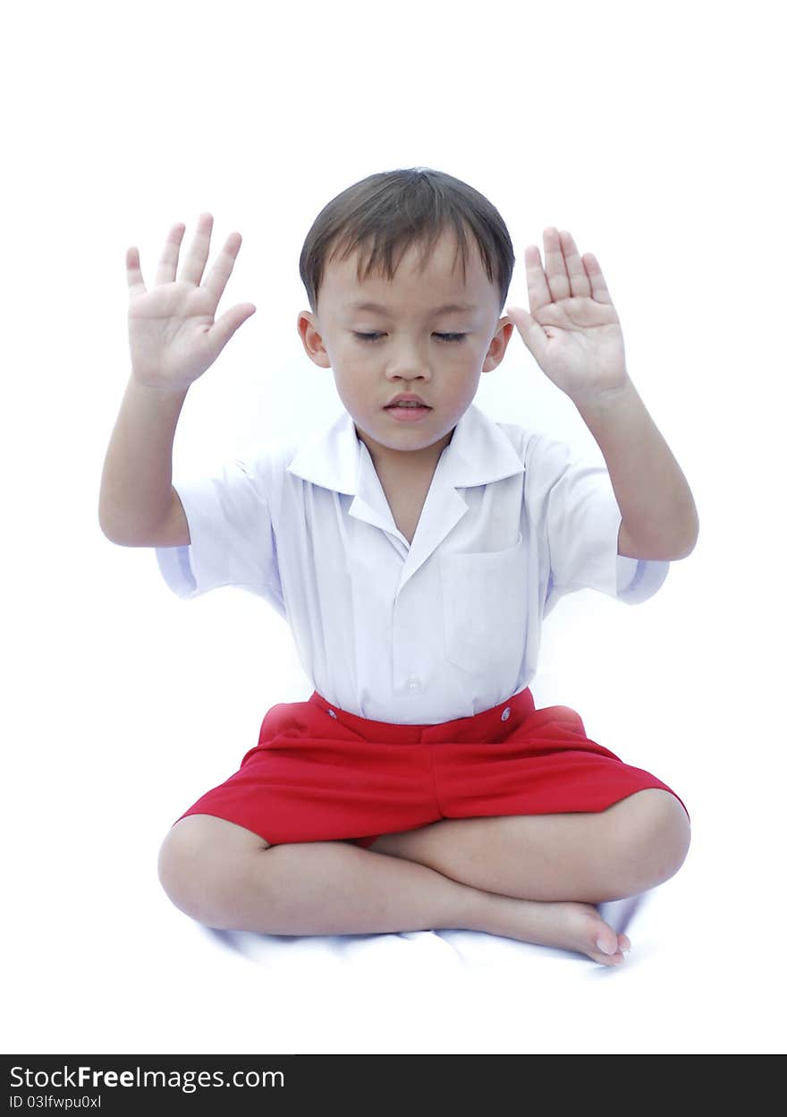 Cute young asian boy in uniform isolated on white background