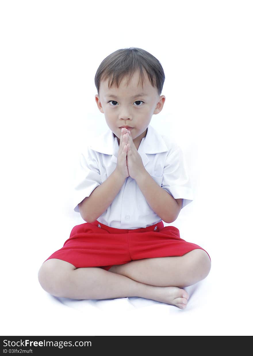 Cute young asian boy in uniform isolated on white background