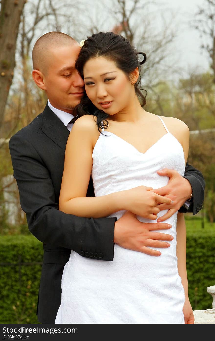 Style happy bride and groom on background of the nature. Style happy bride and groom on background of the nature