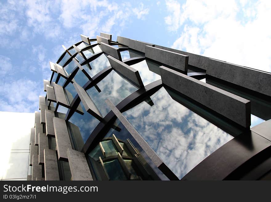 Modern Building Detail Under Cloudy Sky