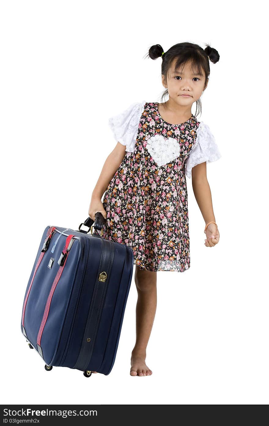 Cute little girl carrying her luggage over white background. Cute little girl carrying her luggage over white background