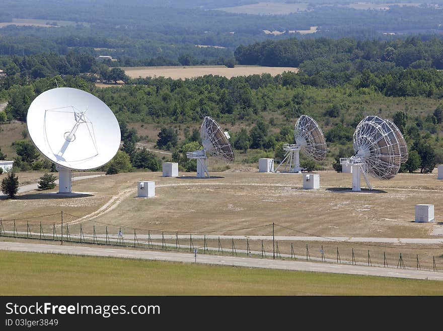 Radio antenna dishes capturing waves in the sky. Radio antenna dishes capturing waves in the sky