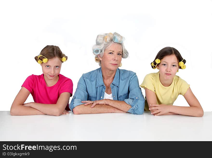 Senior women and kids with hair curlers. Senior women and kids with hair curlers