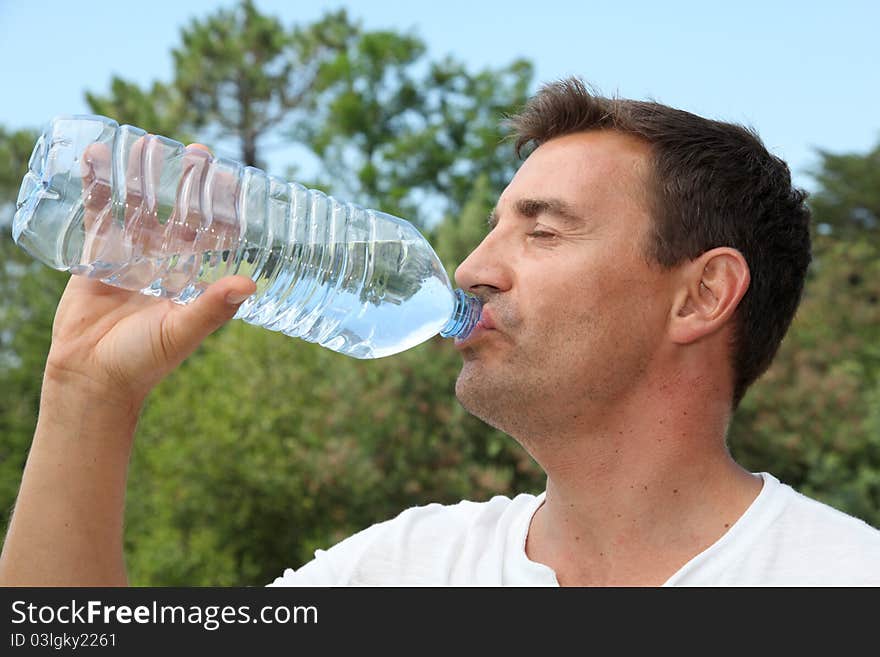 Man drinking water from bottle