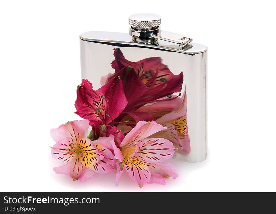 Steel flask for wine and flowers on a white background