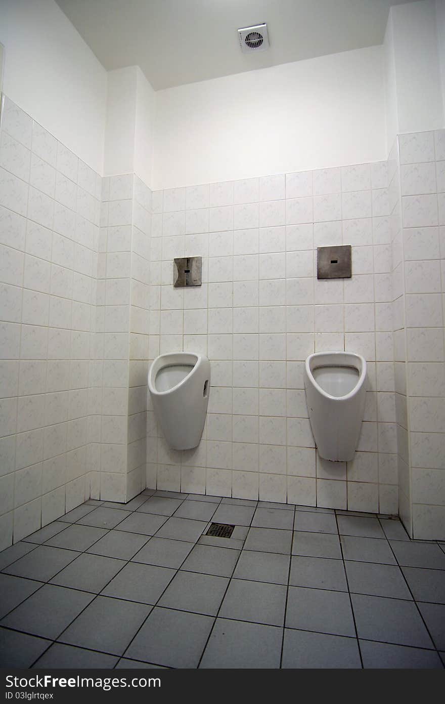 Interior of white toilet for man