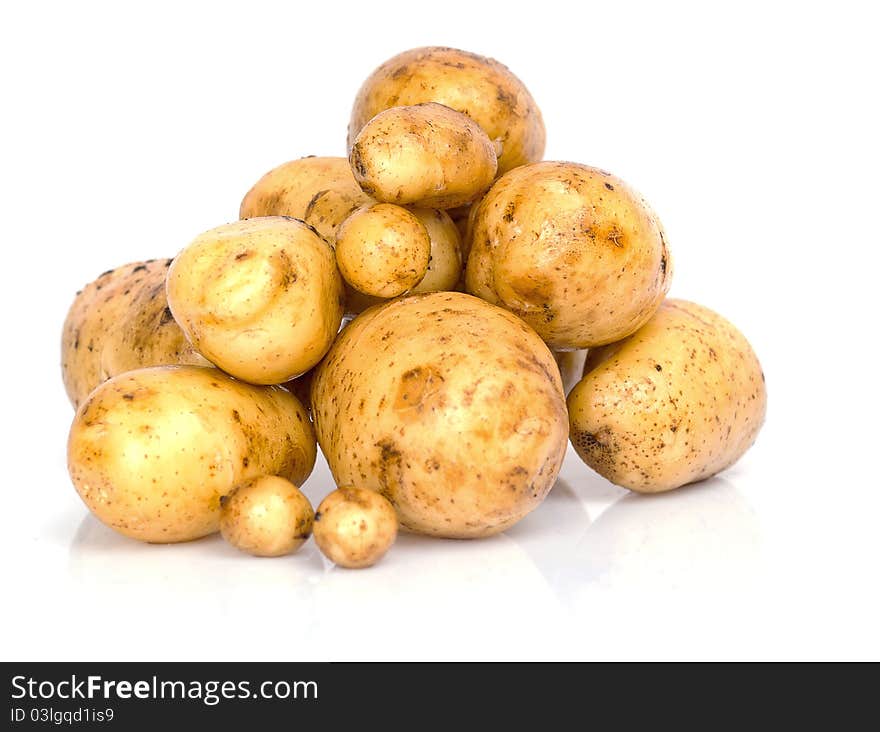 Fresh potatoes on a white