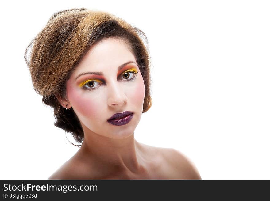 Beautiful young female against white with colourful make up