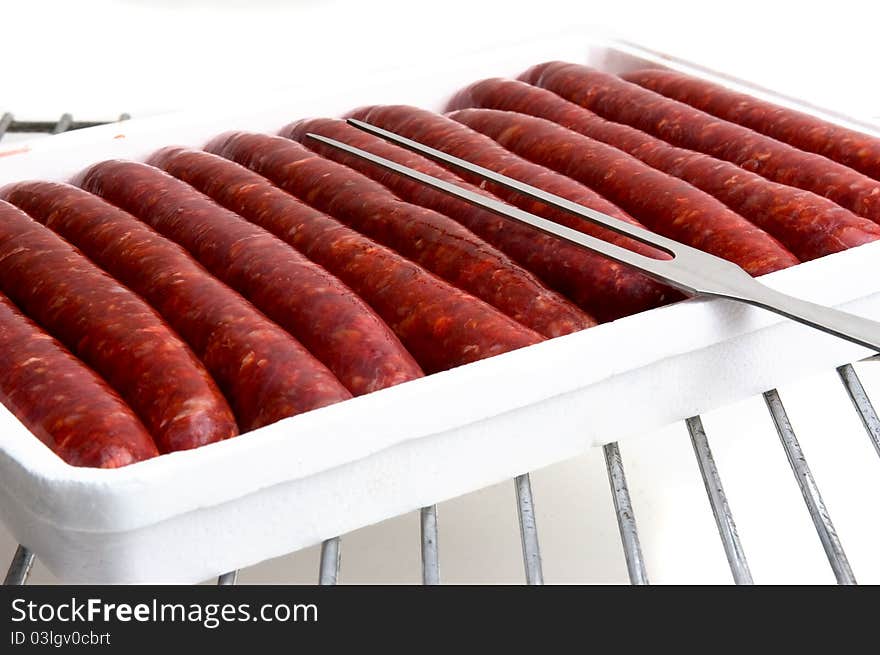 To illustrate the raw sausages grilled summer. To illustrate the raw sausages grilled summer