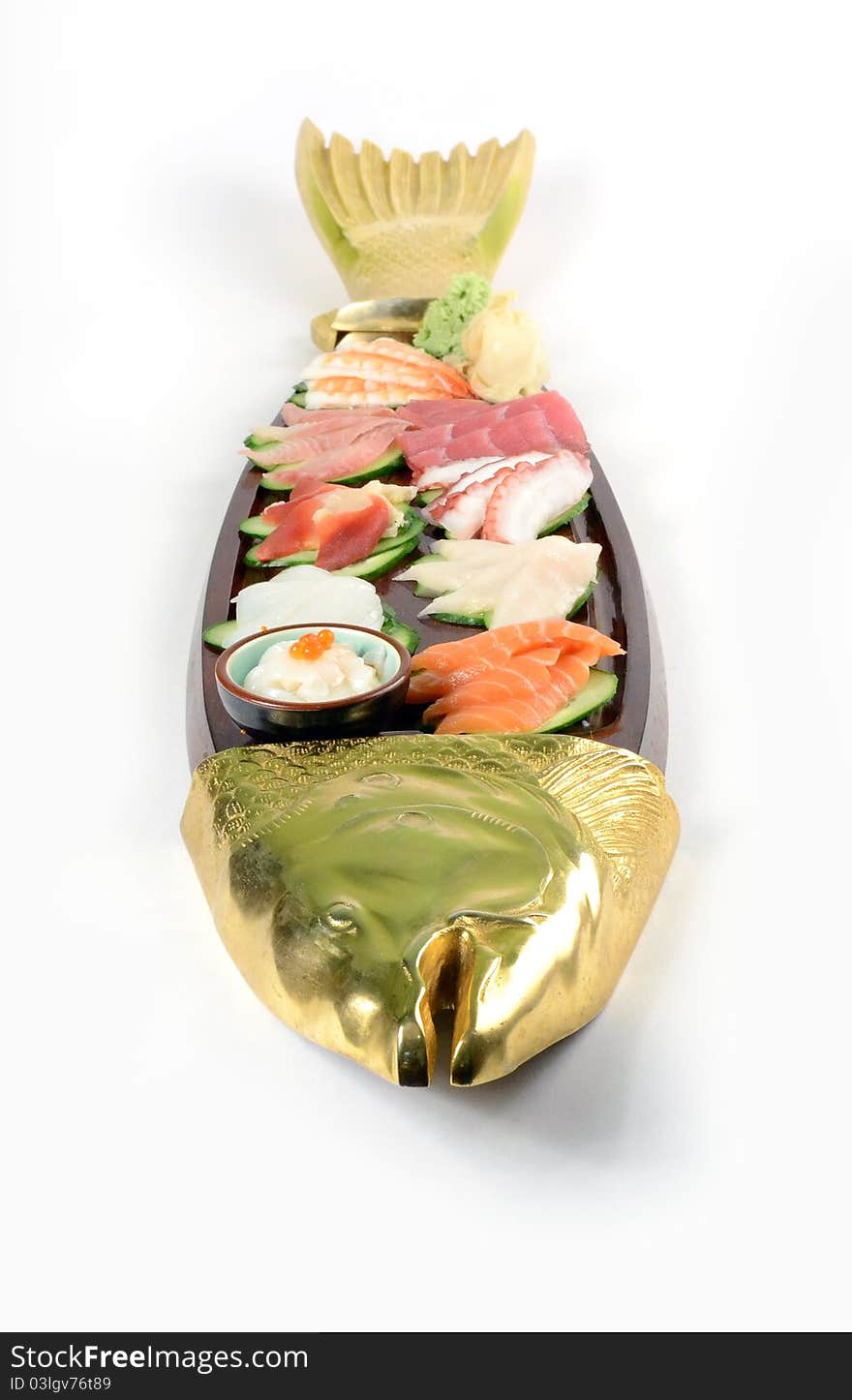 Japanese cuisine. Wooden fish fool of sashimi. Japanese cuisine. Wooden fish fool of sashimi.