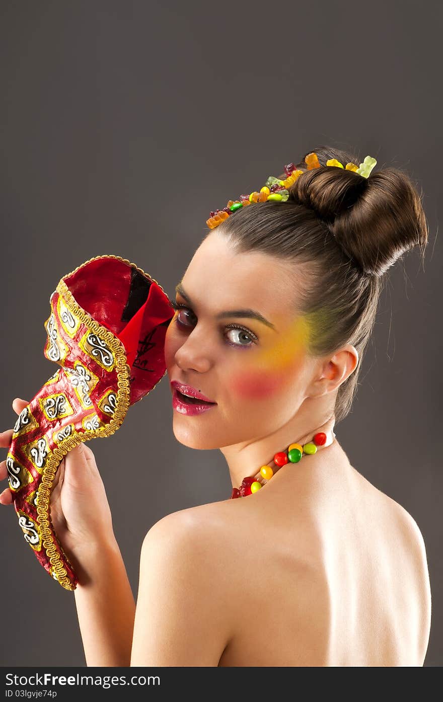 Close-up portrait of beautiful brunette with glamor make-up and color candy style