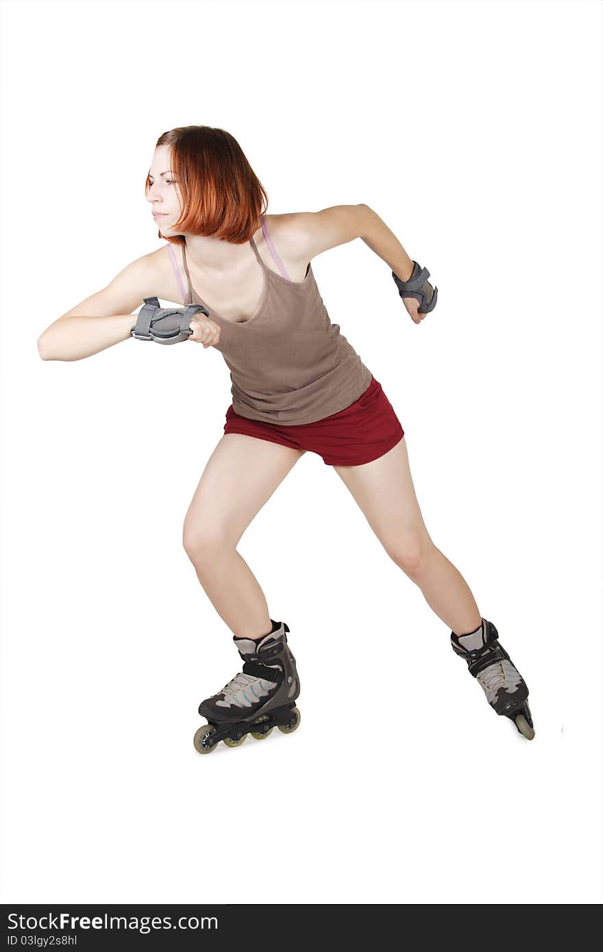 Young beauty girl on rollerblades in start pose isolated