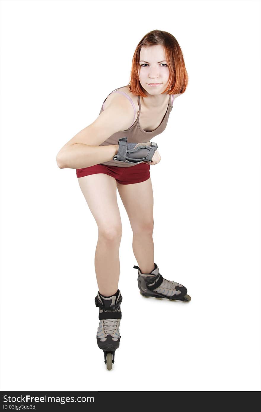 Young beauty girl on rollerblades in start pose isolated