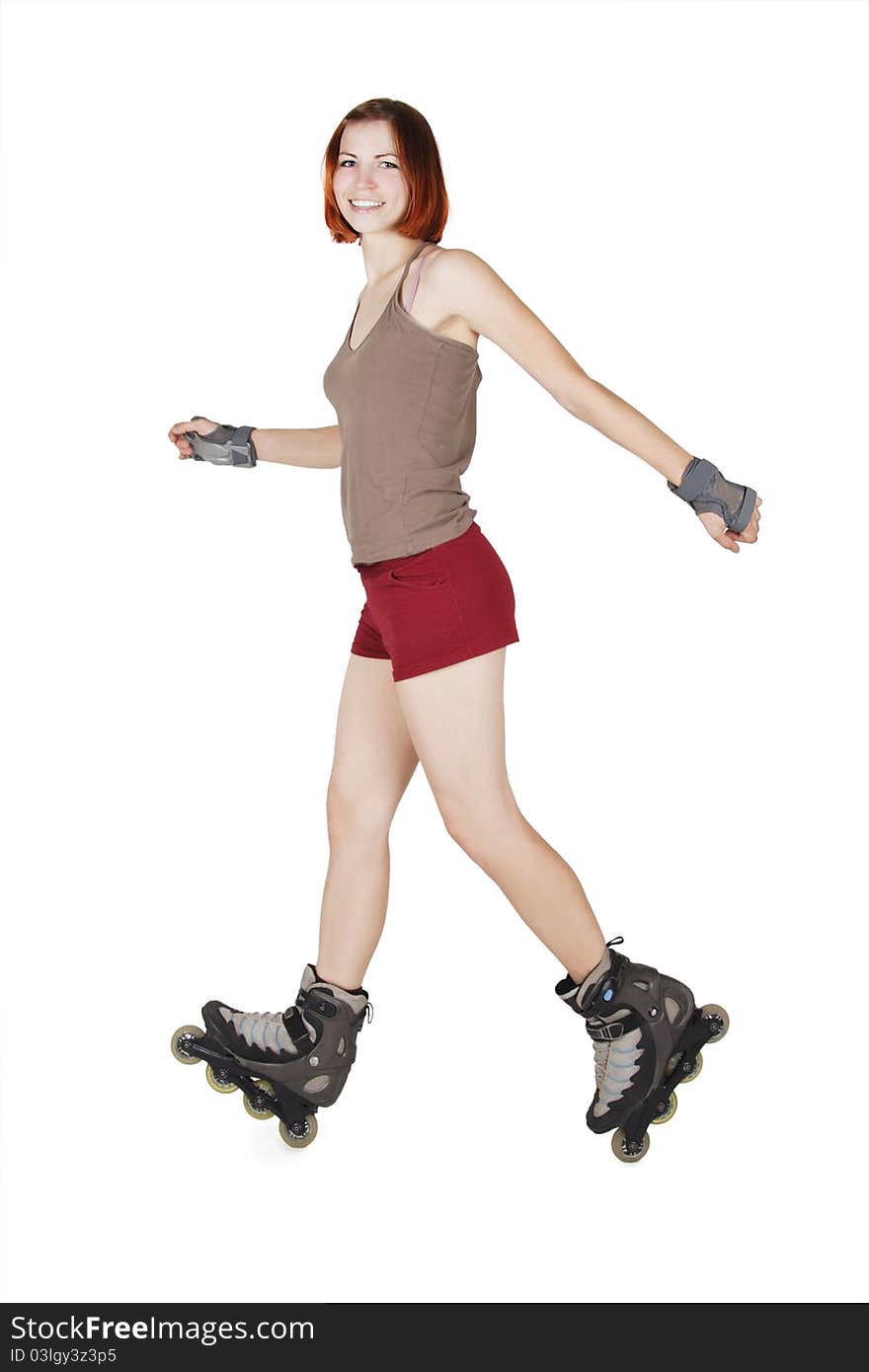 Young beauty girl on rollerblades making trick isolated