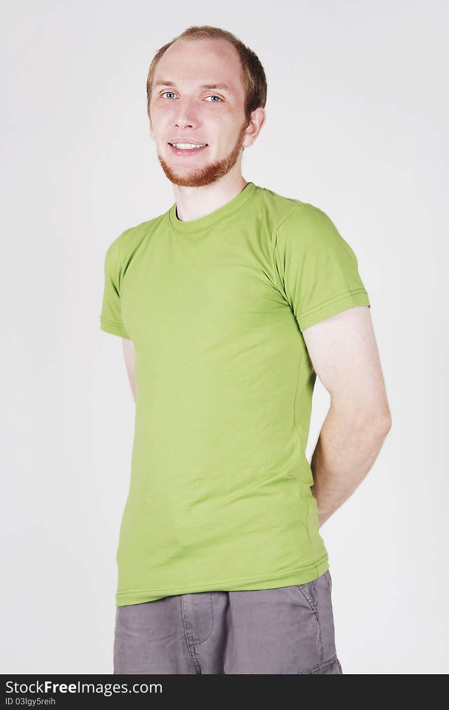 Man in green shirt smiling