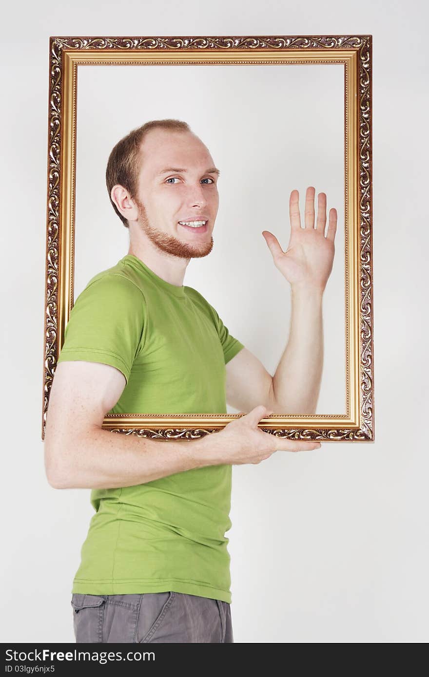 Man holding decorative picture frame