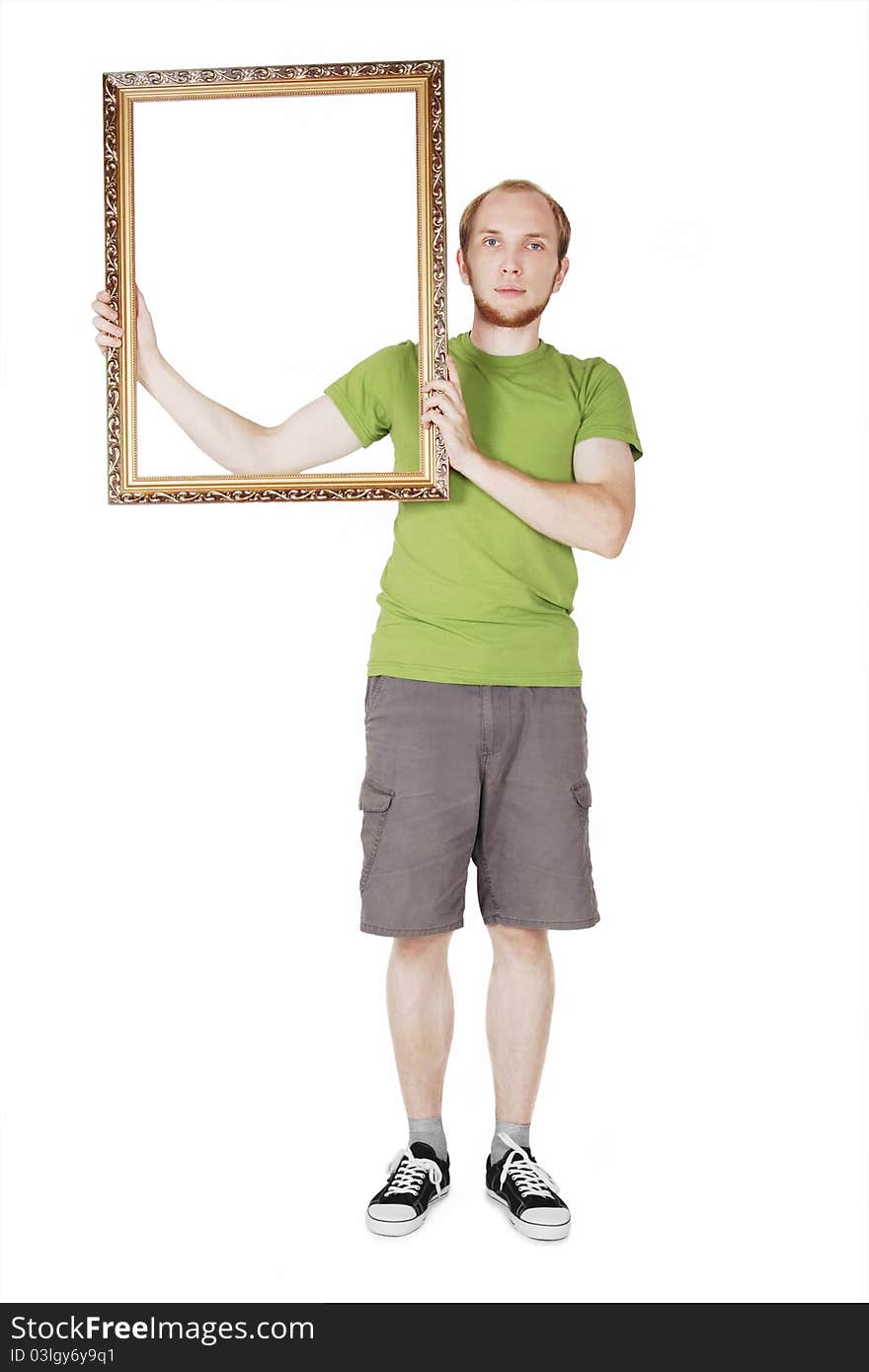 Man in green shirt holding  picture frame