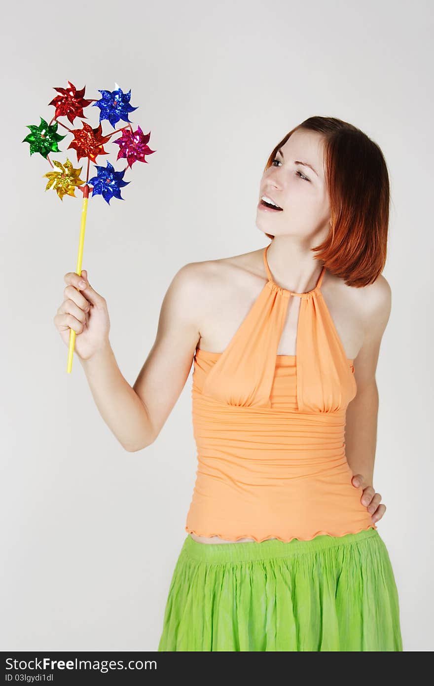 Girl In Bright Clothes Holding Pinwheel