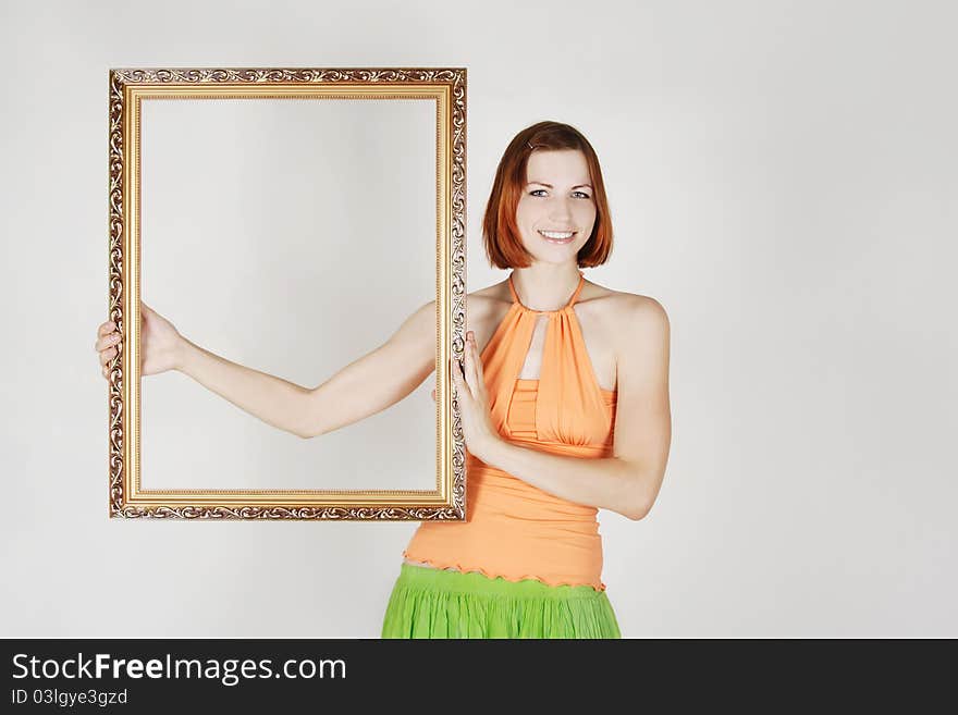 Girl In Bright Clothes Holding Decorative Frame