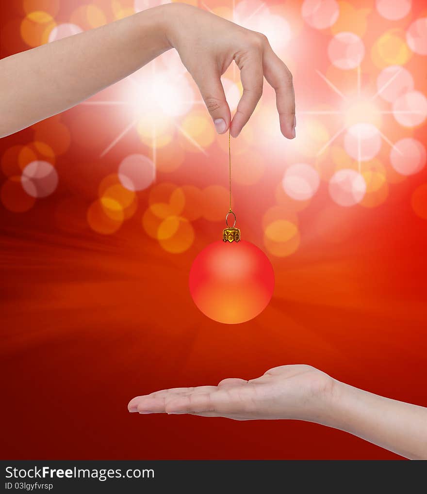 Human hand holding Transparent Christmas ball.