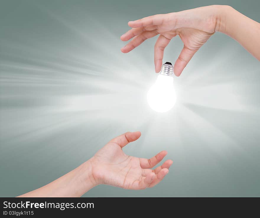 Women hand with Light bulb