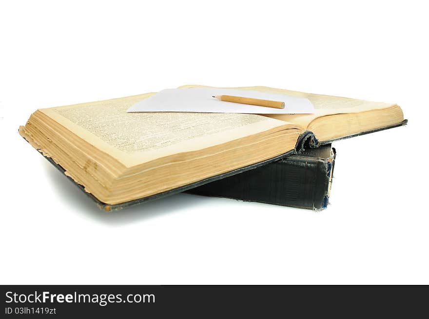 The oldest book and pencil. Isolated on white background