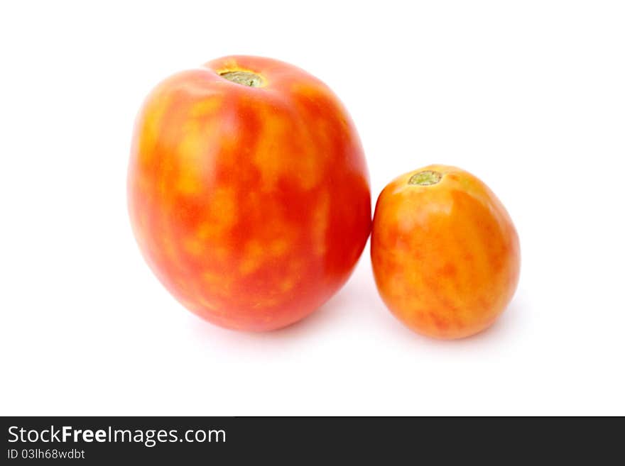 Fresh tomatoes on a white background close-up isolated