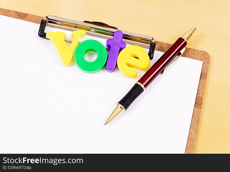 Vote Letters On Clipboard With Pen. Vote Letters On Clipboard With Pen