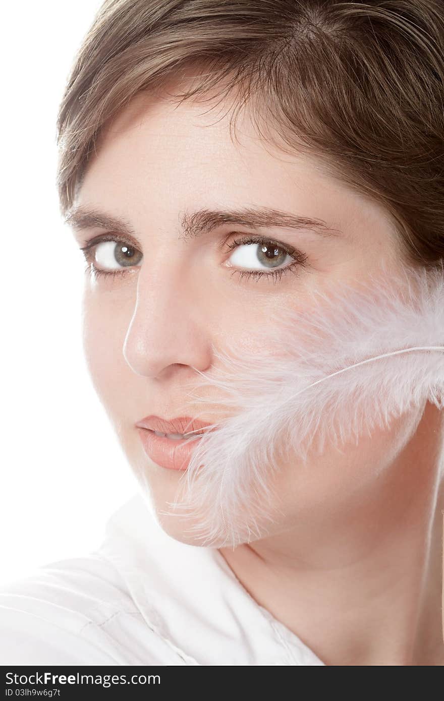 Beautiful young woman with plume - isolated over white background