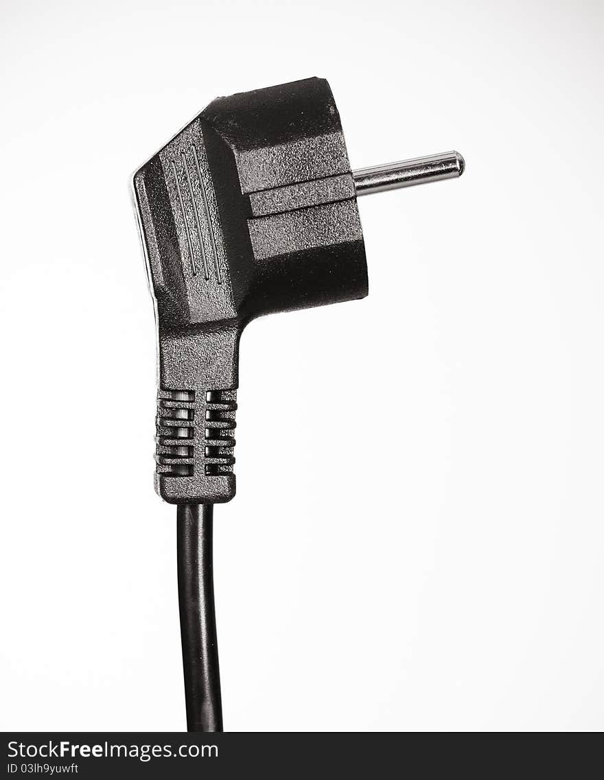 Black plug on white background - side view