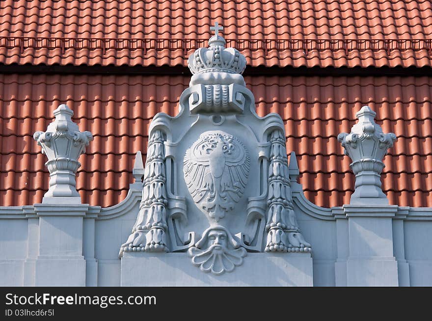 Old retro bas-relief on the roof of old historical building. Old retro bas-relief on the roof of old historical building