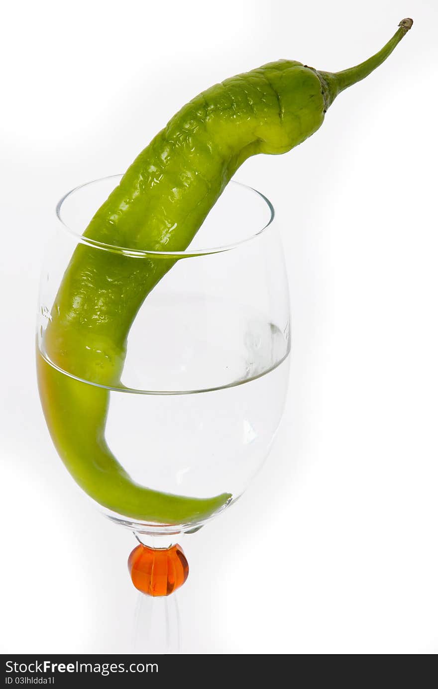 Green Chilli in Wine Glass on white background. Green Chilli in Wine Glass on white background.