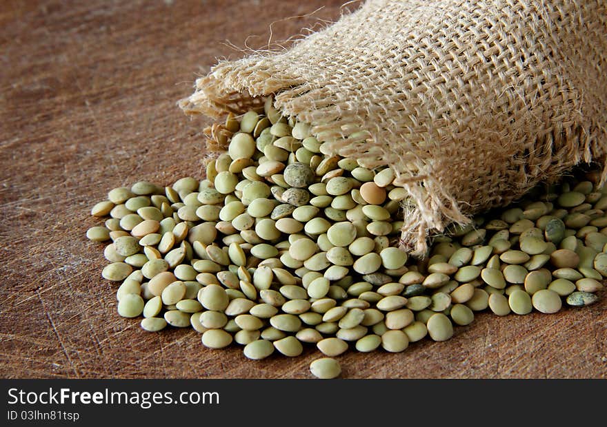 Macro view of lentils on wooden background