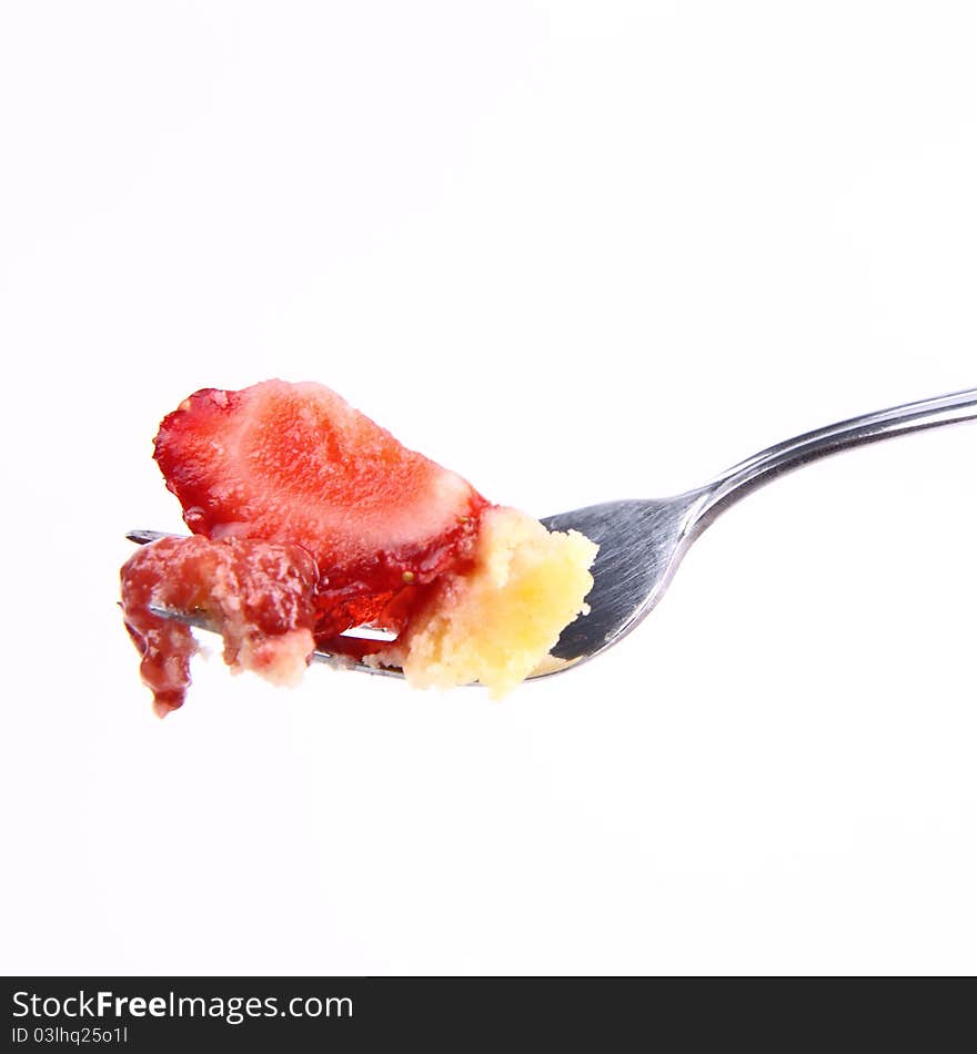 Piece of Strawberry Tart on a fork on a white background