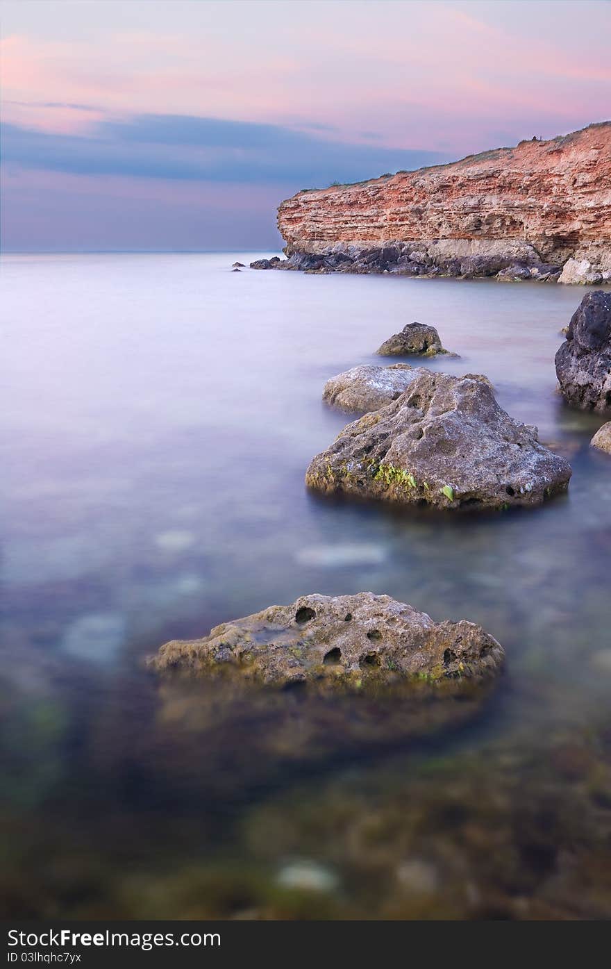 Sea and rock at the sunset.