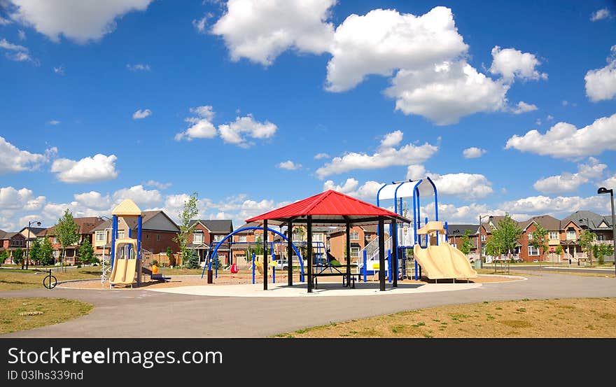 white clouds over neighborhood playground