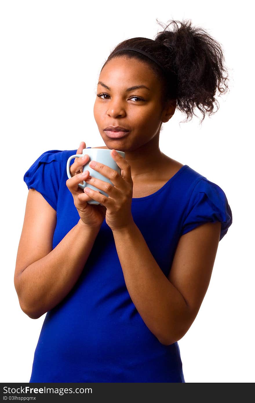 A young woman holding a mug of coffee. A young woman holding a mug of coffee.