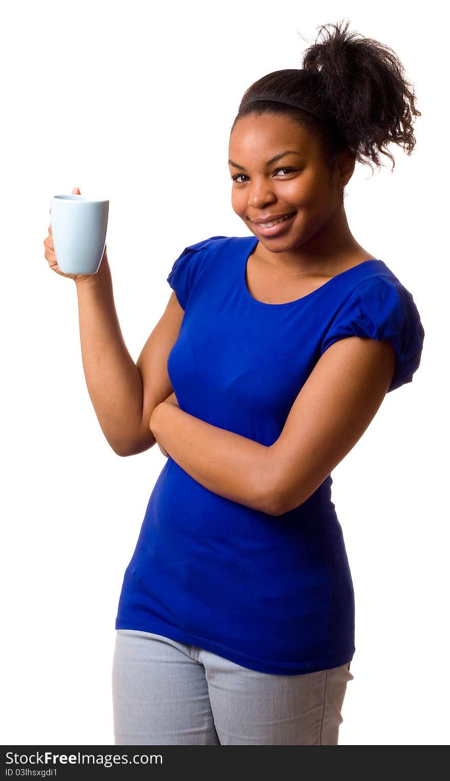 A young woman holding a mug of coffee. A young woman holding a mug of coffee.