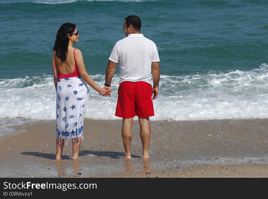 Portrait of a lovely romantic couple on the beach