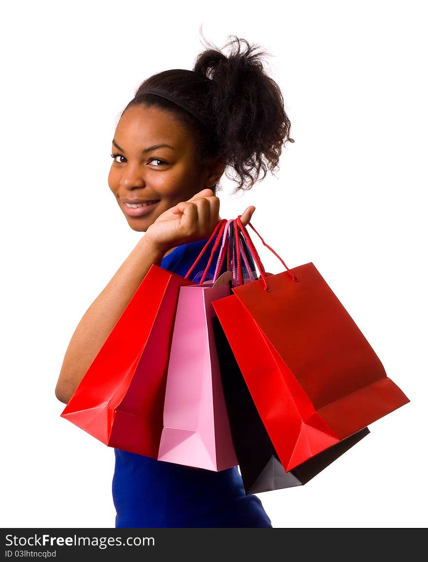 A young woman holding shopping bags isolated on a white background. A young woman holding shopping bags isolated on a white background.