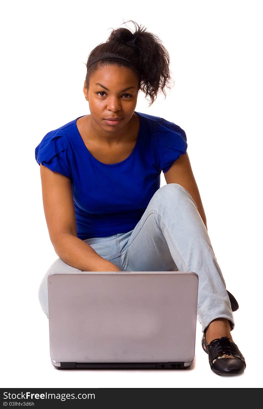 A young woman with a laptop computer. A young woman with a laptop computer.