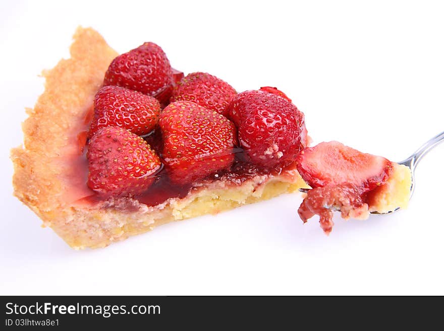 Strawberry Tart portion, a bite on a fork, on a white background