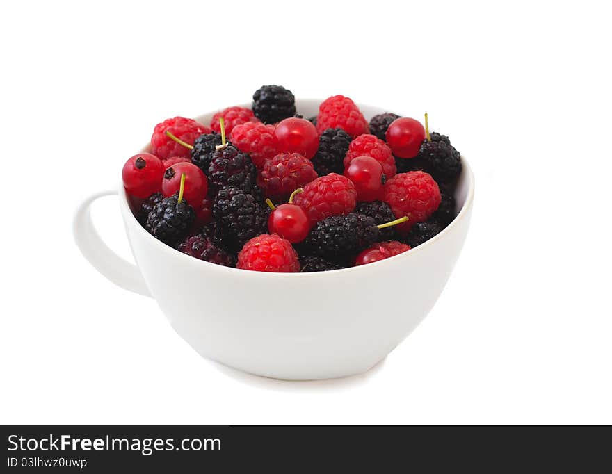 Fresh berries in bowl over white. Fresh berries in bowl over white