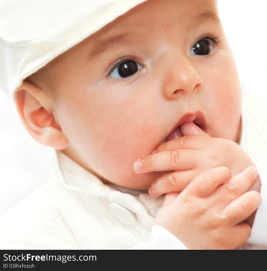 Closeup portrait of cute smiling baby boy