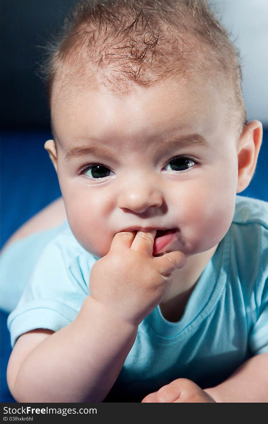 Closeup portrait of cute smiling baby boy