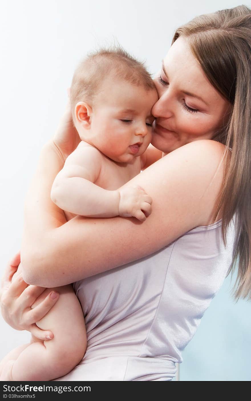 Picture of happy mother with baby over white. Picture of happy mother with baby over white