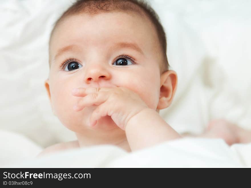 Closeup portrait of cute smiling baby boy