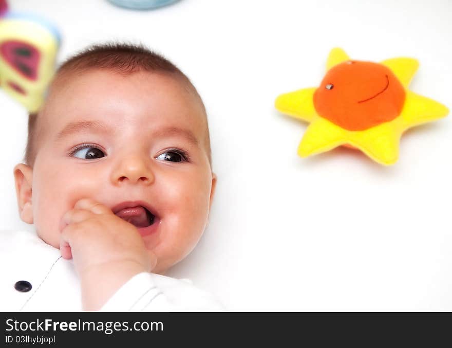 Closeup portrait of cute smiling baby boy