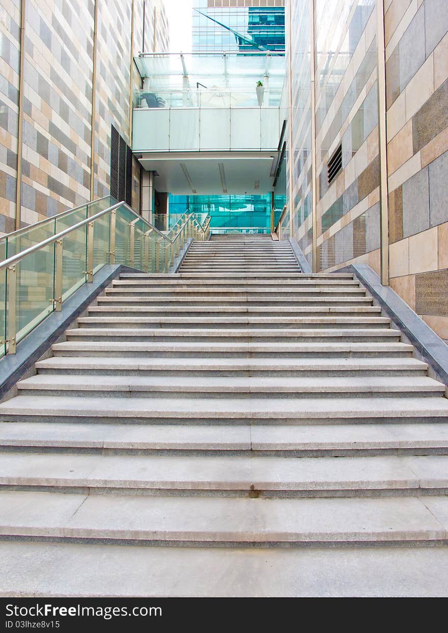 Stairs in office building with high wall